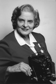 An undated photo from Faye Schulman, via Second Story Press, of herself with the Compur camera she used during WWII. 