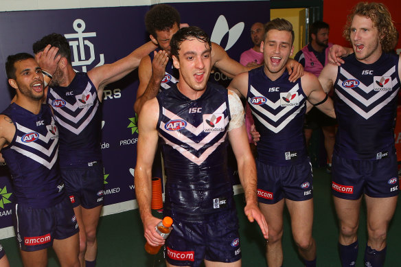 Max Duffy, pictured here enjoying his first win for Fremantle in 2014, is a former Docker.