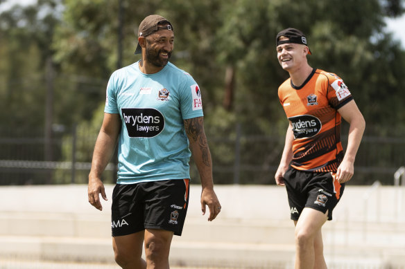 Wests Tigers coach Benji Marshall shares a light moment at training with his possible heir apparent Lachlan Galvin.