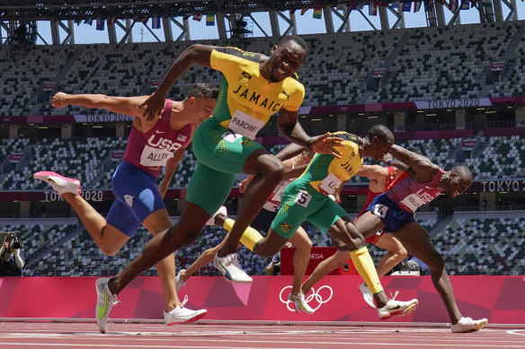 Hansle Parchment of Jamaica wins the men’s 110-metre hurdles.