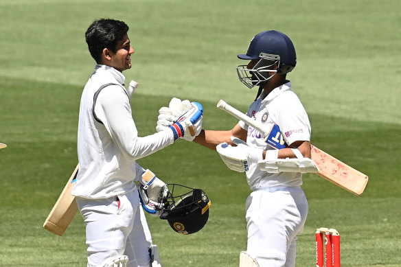 Shubman Gill and Ajinkya Rahane celebrate after India's victory in the second Test on Tuesday.