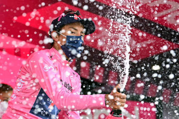 Egan Bernal celebrates after retaining the pink jersey on the 20th stage.