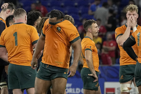 Pone Fa’amausili covers his face after the loss to Wales.