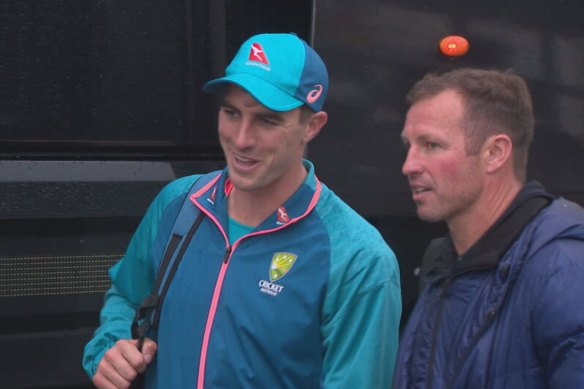 Australian Test skipper Pat Cummins talks with former Socceroos captain Lucas Neill after day five at Old Trafford.