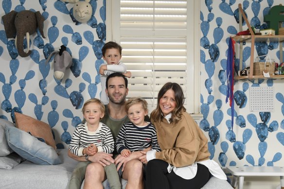 Lucy and Jordan Lewis with their sons, twins Ollie and Hughie, and Freddie. They followed a sleeping method for the twins recommended by Melbourne paediatrician Dr Daniel Golshevsky with great success.