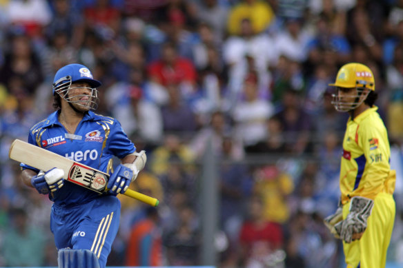Sachin Tendulkar batting for the Mumbai Indians in 2012, with Chennai Super Kings captain MS Dhoni watching on.