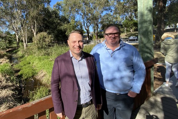 Lord Mayor Adrian Schrinner and flood recovery taskforce chair Cr Andrew Wines release council’s 2022 flood action plan on July 30.