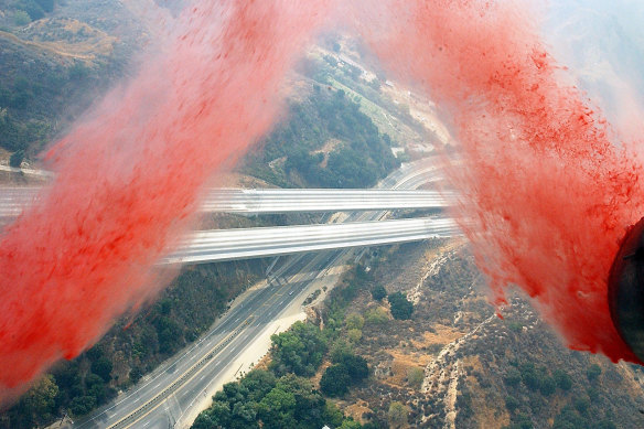 A C-130 Hercules drops fire retardant over southern California. 