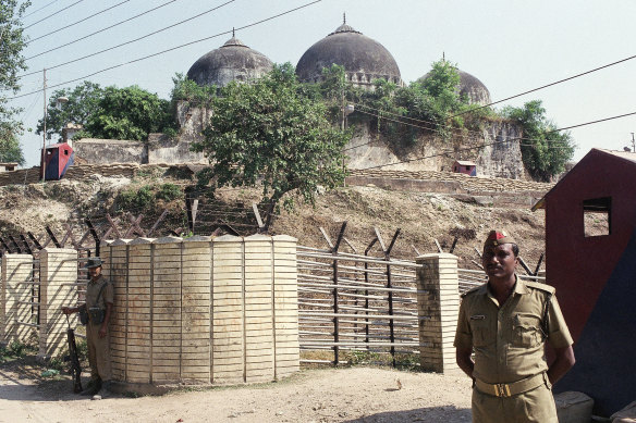 Security officers guard the Babri Mosque in Ayodhya, closing off the disputed site claimed by Muslims and Hindus in 1990.