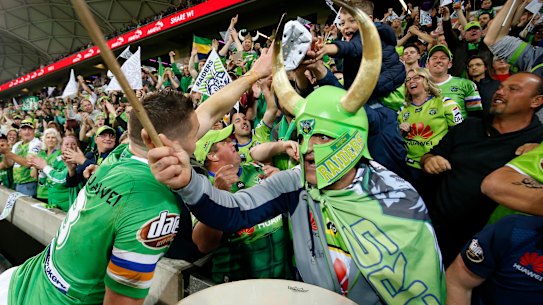 Sold out: Raiders fans celebrate with Jarrod Croker in Melbourne.