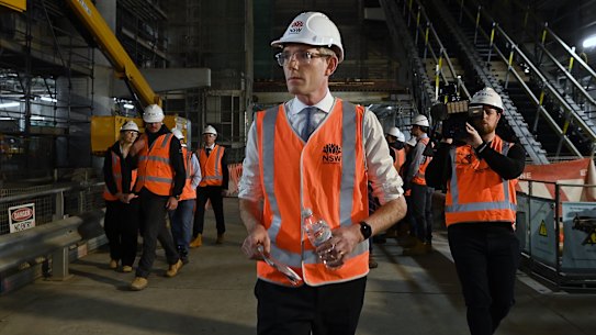 NSW Premier Dominic Perrottet walks through a Metro tunnel beneath Martin Place on Wednesday.