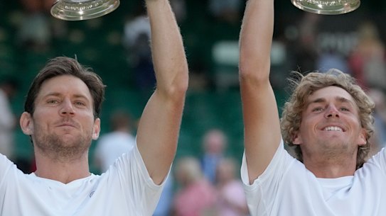 Matthew Ebden, left, and Max Purcell of Australia celebrate with their trophies after beating Mate Pavic and Nikola Mektic of Croatia to win the final of the Wimbledon men’s doubles.