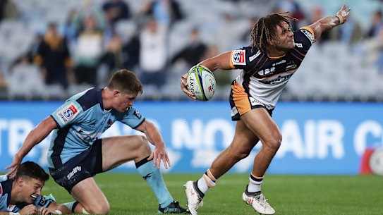 Issak Fines celebrates a try for the Brumbies.