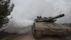 An Israeli tank moves near the border with the Gaza Strip on January 17.