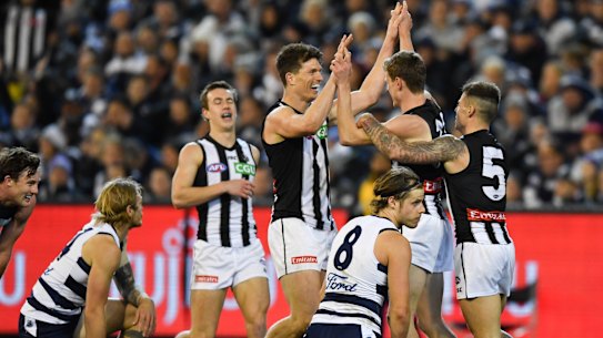 Collingwood celebrate as the Cats are left to rue their missed chances and prepare for a tough match next week.
