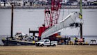 Salvage crews work near the wreckage site in the Potomac River of a mid-air collision between an American Airlines jet and a Black Hawk helicopter in early February.