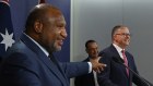 Papua New Guinean Prime Minister James Marape (left) and Australian Prime Minister Anthony Albanese (right) with Peter V’Landys the Australian Rugby League Commission chairman (centre) announce a PNG rugby league team.