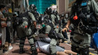  A man is detained by riot police during a demonstration on July 1, 2020 in Hong Kong, China. Hong Kong marks the 23rd anniversary of its handover to China on July 1 after Beijing imposed the new national security law.