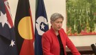 Foreign Minister Penny Wong announces sanctions at a press conference in London.