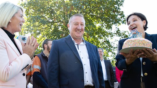 NSW Labor Leader Jodi McKay presents Upper Hunter NSW Labor candidate, Jeff Drayton, with a birthday cake in Singleton on Tuesday.