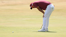 Lucas Herbert reacts to missing a putt on the 18th hole.