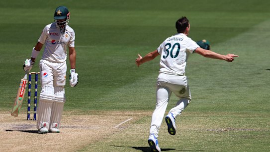 Pat Cummins celebrates after dismissing Pakistan’s Shan Masood on Friday.