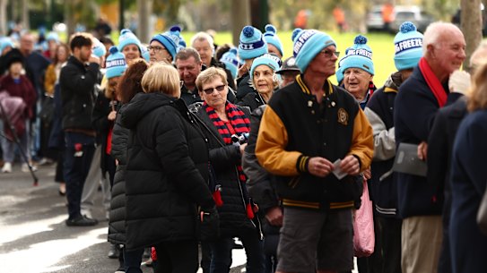Queues of people stream into the MCG for Neale Daniher’s state funeral service.