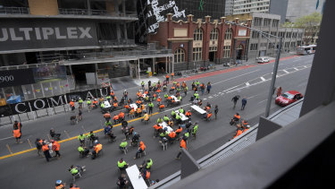 Construction workers using Lonsdale Street as a tearoom on Friday. 