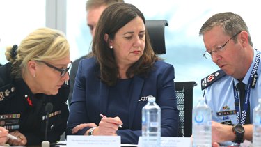 Queensland Fire and Emergency Services Commissioner Katarina Carroll, Premier Annastacia Palaszczuk and State Disaster Coordinator Bob Gee review the latest reports on the bushfires.