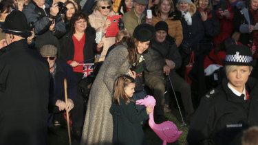 Catherine, Duchess of Cambridge and Princess Charlotte greet well-wishers.