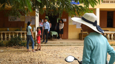 People arrive to cast their vote at Koktrob School in Kbal Seh village, in Kandal Province.