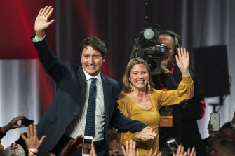 Justin Trudeau and wife Sophie Gregoire Trudeau go on stage at Liberal election headquarters in Montreal.