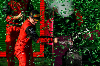 Leclerc celebrates on the podium.