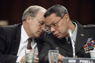 Dick Cheney, left, and Colin Powell huddle before testifying to the Senate Armed Services Committee in 1991.