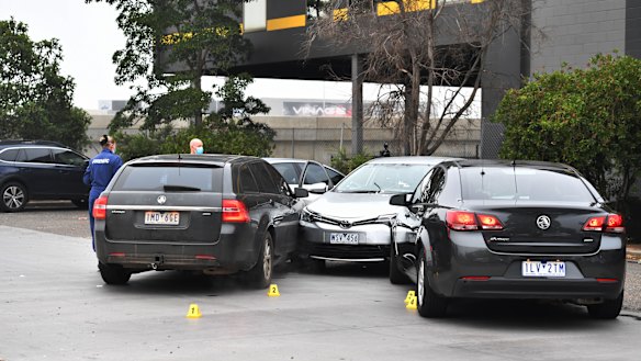 A man was shot by police after he allegedly rammed unmarked police cars in a McDonald's car park.