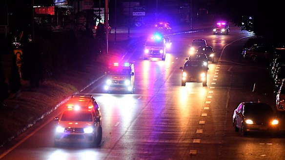 Ambulances drive towards the hospital in Chiang Rai.