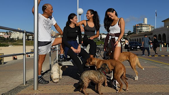 "Iconic event": Charlie Teo with his daughters (left to right) Katie, left, Nikki, centre, and Alex.