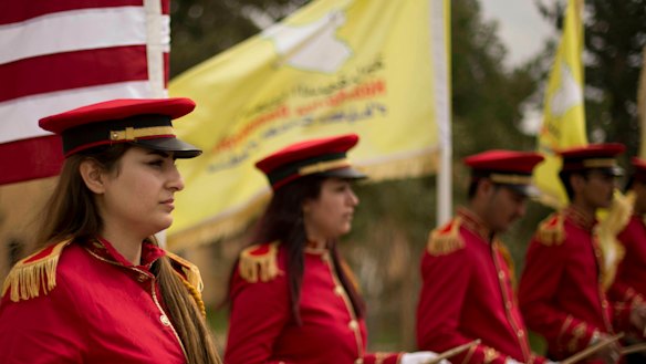 A military band performs ahead of a ceremony at al-Omar Oil Field marking the US-backed Syrian Democratic Forces (SDF) capture of Baghouz, Syria, after months of fighting to oust Islamic State militants on Saturday.
