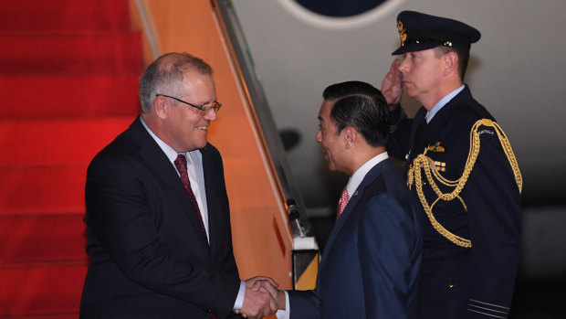 Prime Minister Scott Morrison is greeted by the chairman of Indonesia's Investment Coordinating board Thomas Trikasih Lembong in Jakarta.