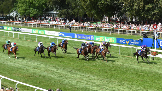 All the way: US Navy Flag (right) wins the Darley July Cup at Newmarket.