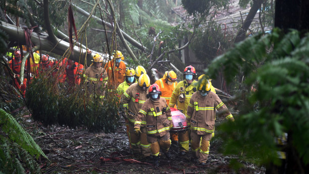 A woman was rescued from her Olinda house last Thursday after it damaged by a falling tree.