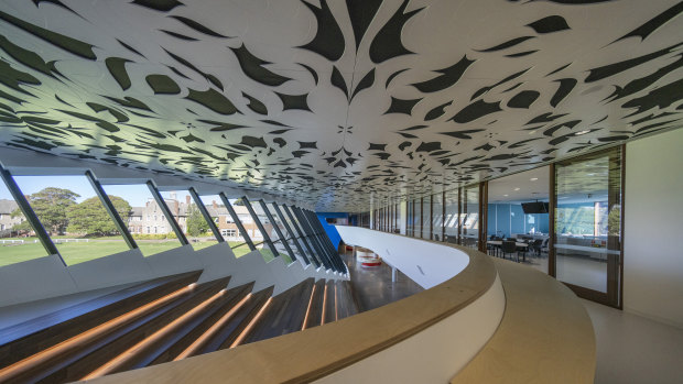 The main auditorium features a laser cut MDF ceiling with a floral motif.
