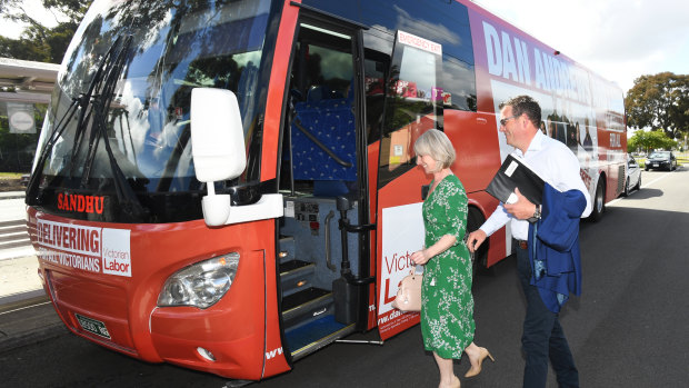 Victorian Premier Daniel Andrews and wife Catherine Andrews board the Labor bus.