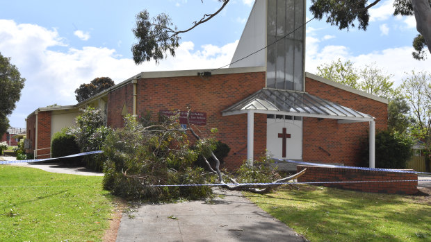 The fallen tree branch outside St John Vianney Church.