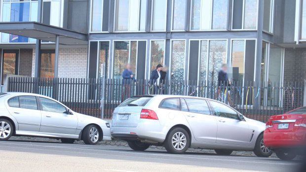 Michael Settle (centre), former field organiser, was questioned by police in Ballarat. 