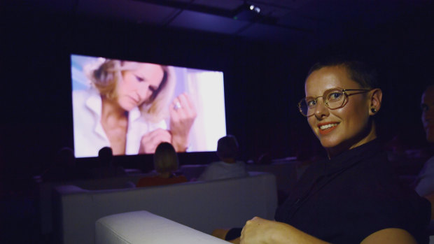 Jess Kempt watching The Clock at the Australian Centre for the Moving Image.