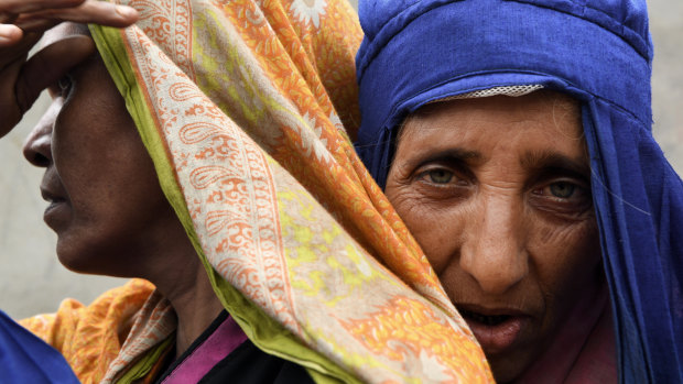 Rohingya refugees queue for a meal provided by a Turkish aid agency at a food distribution site in Cox’s Bazar. The refugee camps in Cox’s Bazar are home to over 900,000 Rohingya refugees who fled Myanmar.