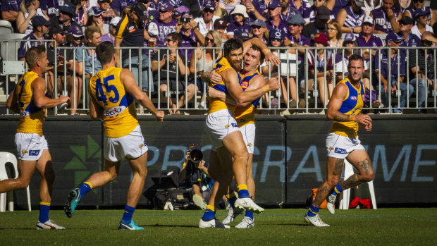 Josh Kennedy celebrates a goal in the last derby... he won't be out there this time around.