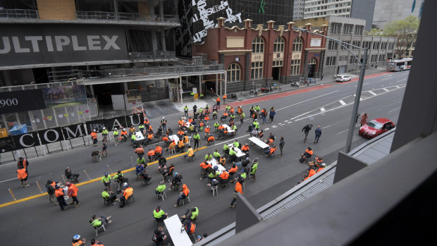 Construction workers using Lonsdale Street as a tearoom on Friday. 