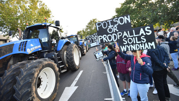 Trucks block central Werribee in demonstration against a plan to dump contaminated soil near homes.